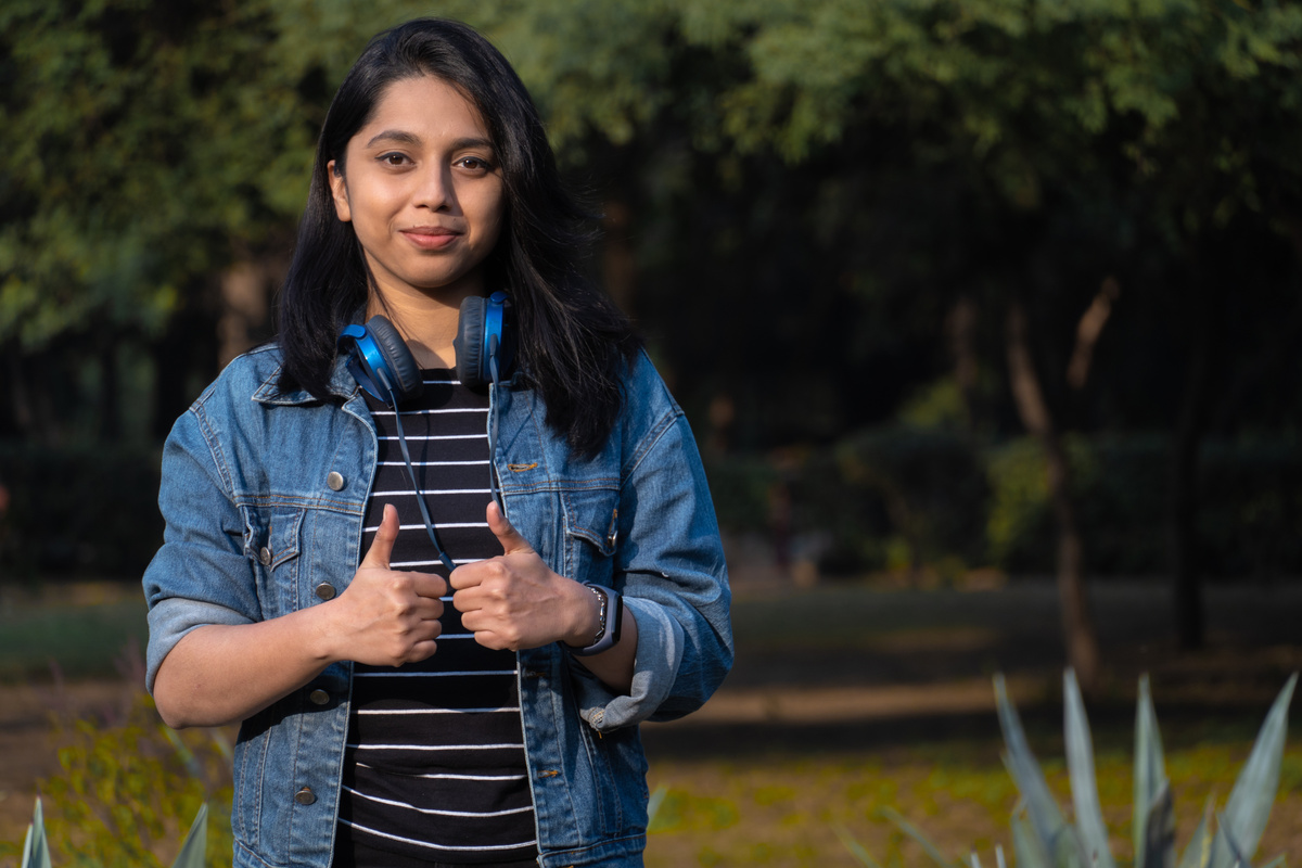 Indian girl student giving thumbs up